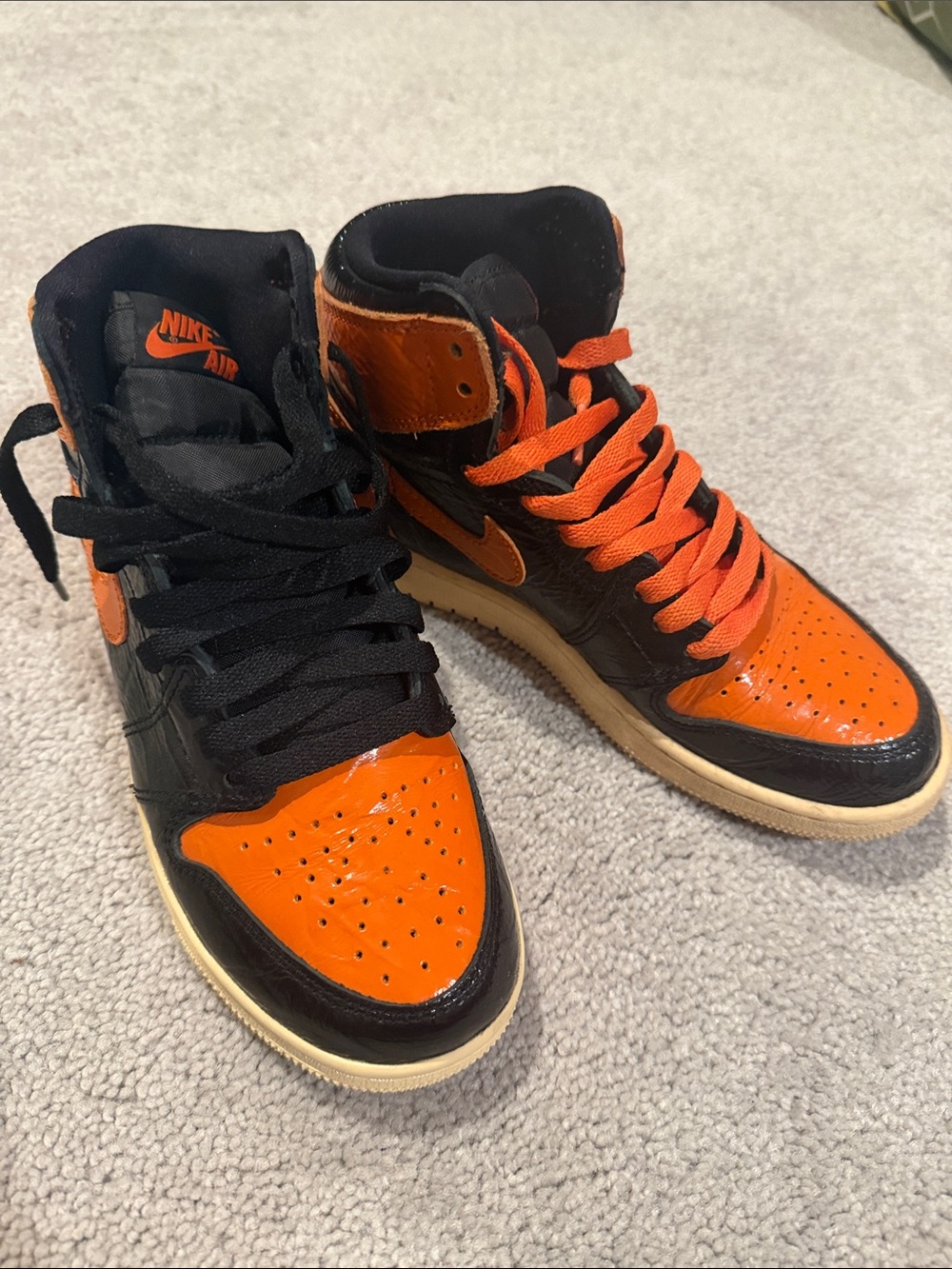 Jordan’s Nike Black & Orange High-Top Sneakers